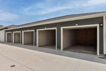 a row of garage doors in front of a building  at Aventura at Hawk Ridge, Lake St Louis